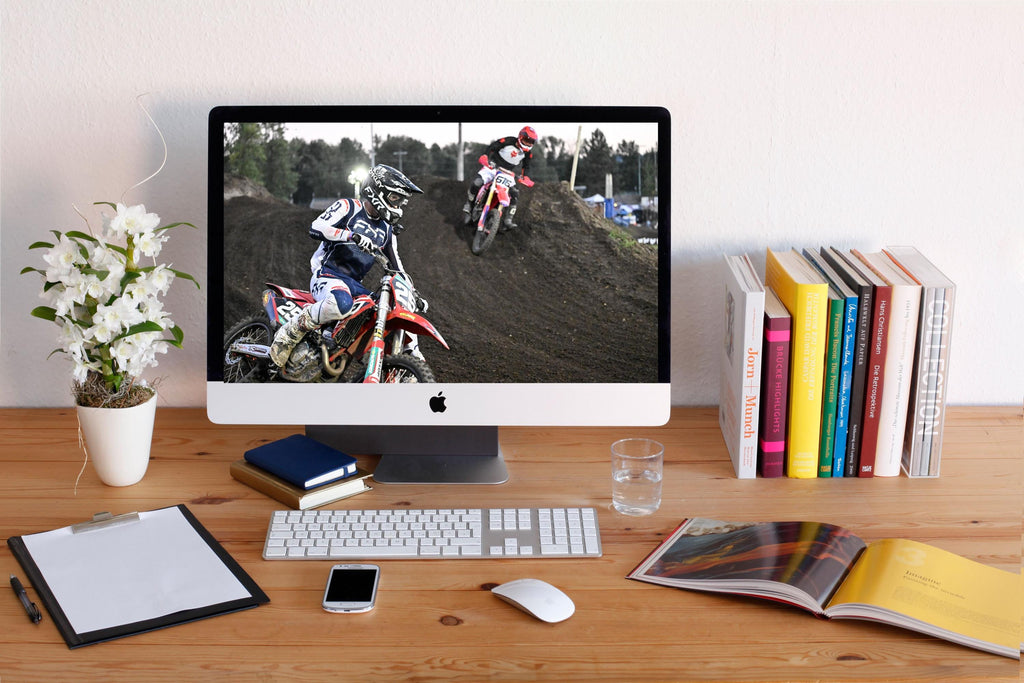 Motorcyclists racing through a turn: Motorsports Photography