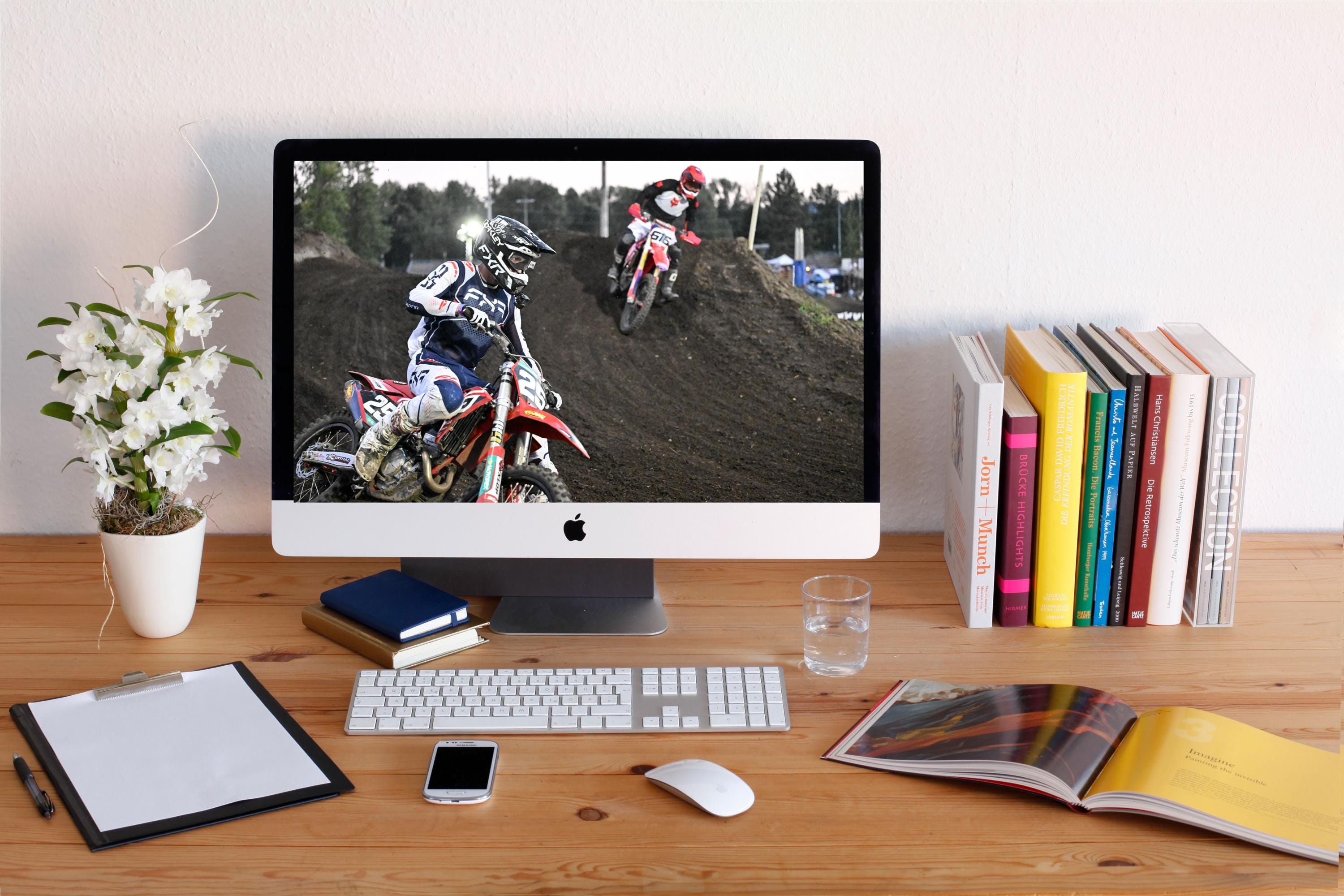 Motorcyclists racing through a turn: Motorsports Photography