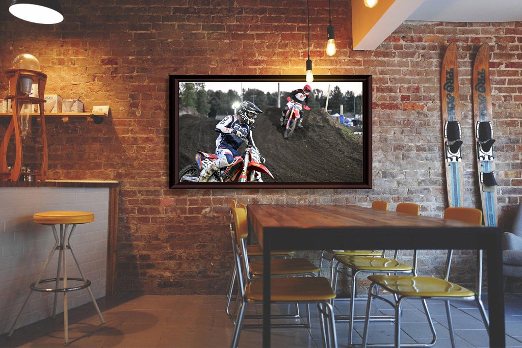 Motorcyclists racing through a turn: Motorsports Photography