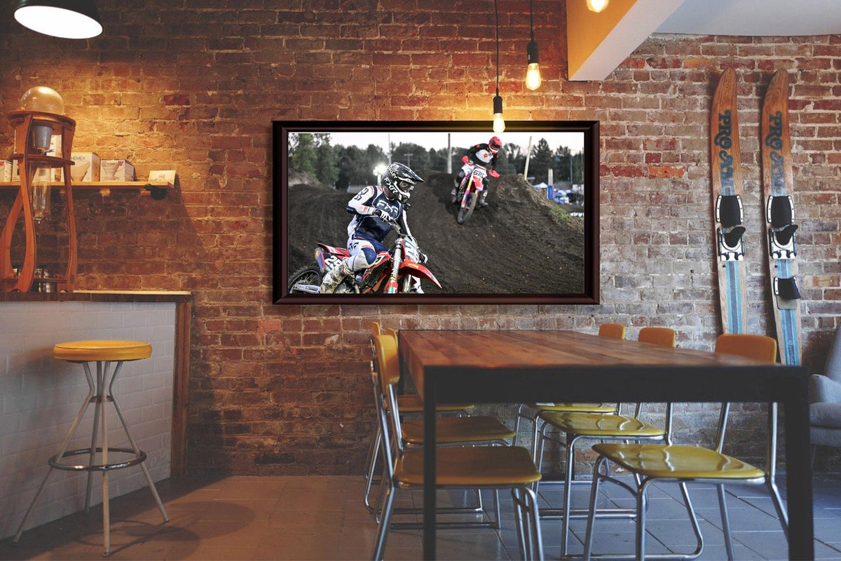 Motorcyclists racing through a turn: Motorsports Photography