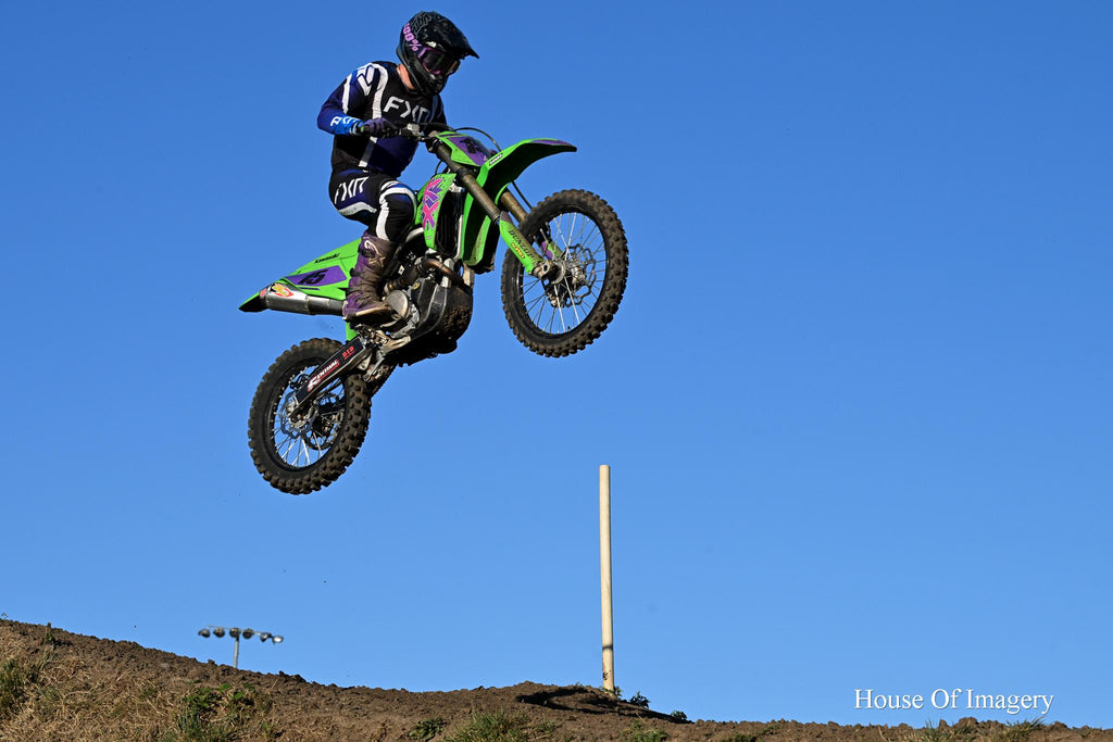 Motorcycle Racer Flying Through the Air: Motorsports Photography