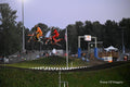 Motorcyclists racing while flying through the air: Motorsports Photography