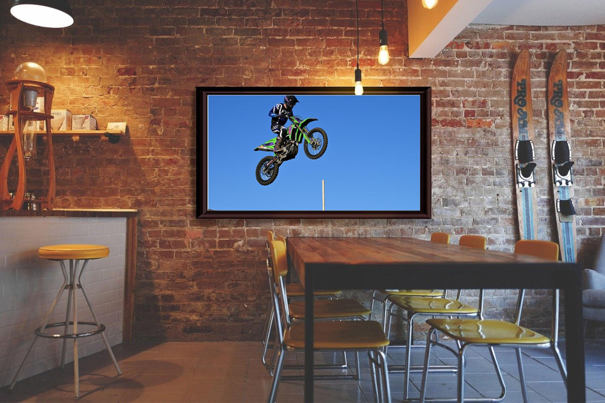 Motorcycle Racer Flying Through the Air: Motorsports Photography