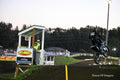 Motocross Motorcyclist makes jump under the lights: Motorsports Photography